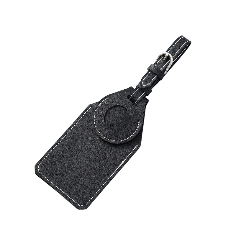 Black leather luggage tag on a light gray surface